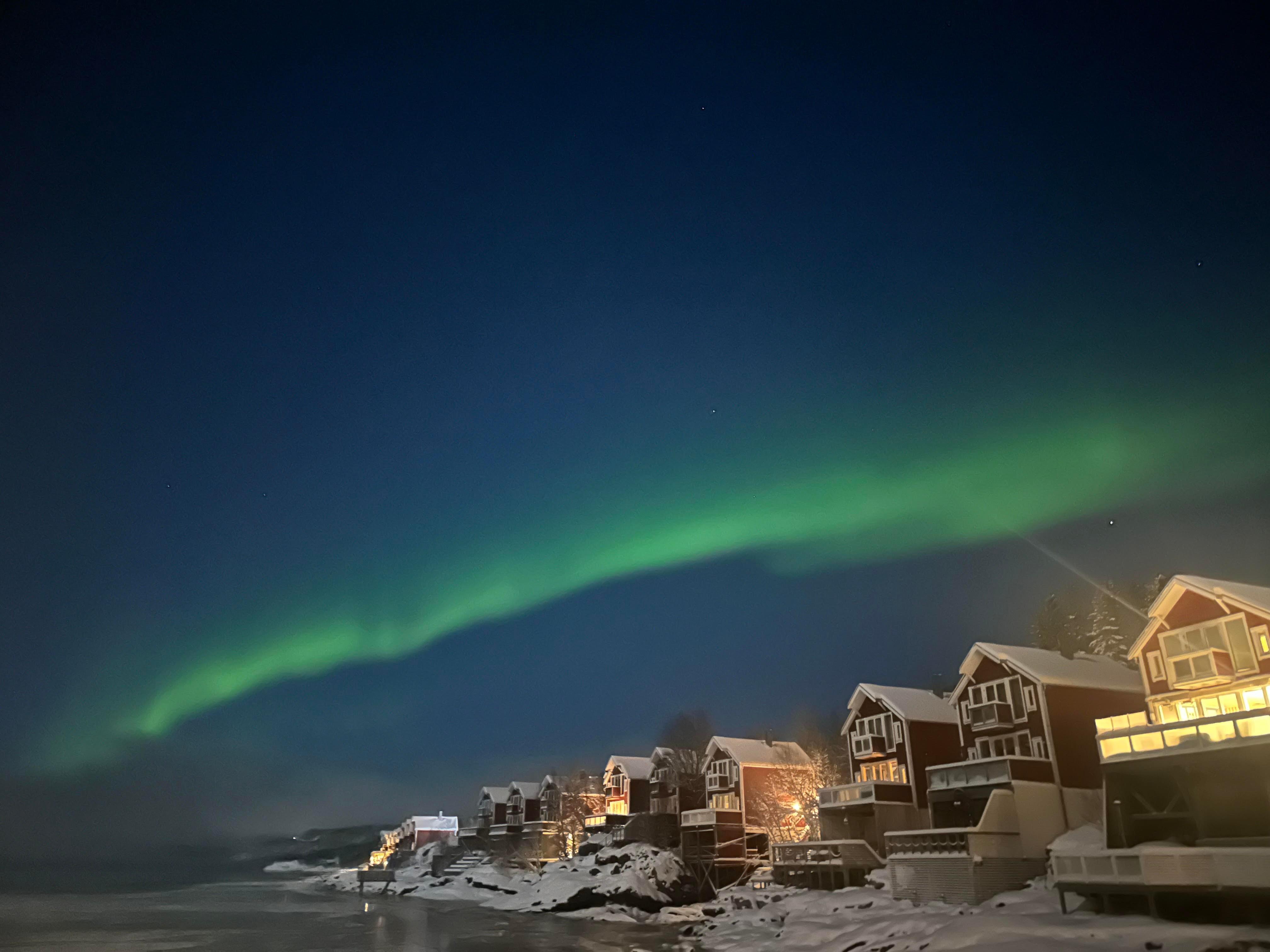 Water front cabins framed by the northern lights. We saw them every night.
