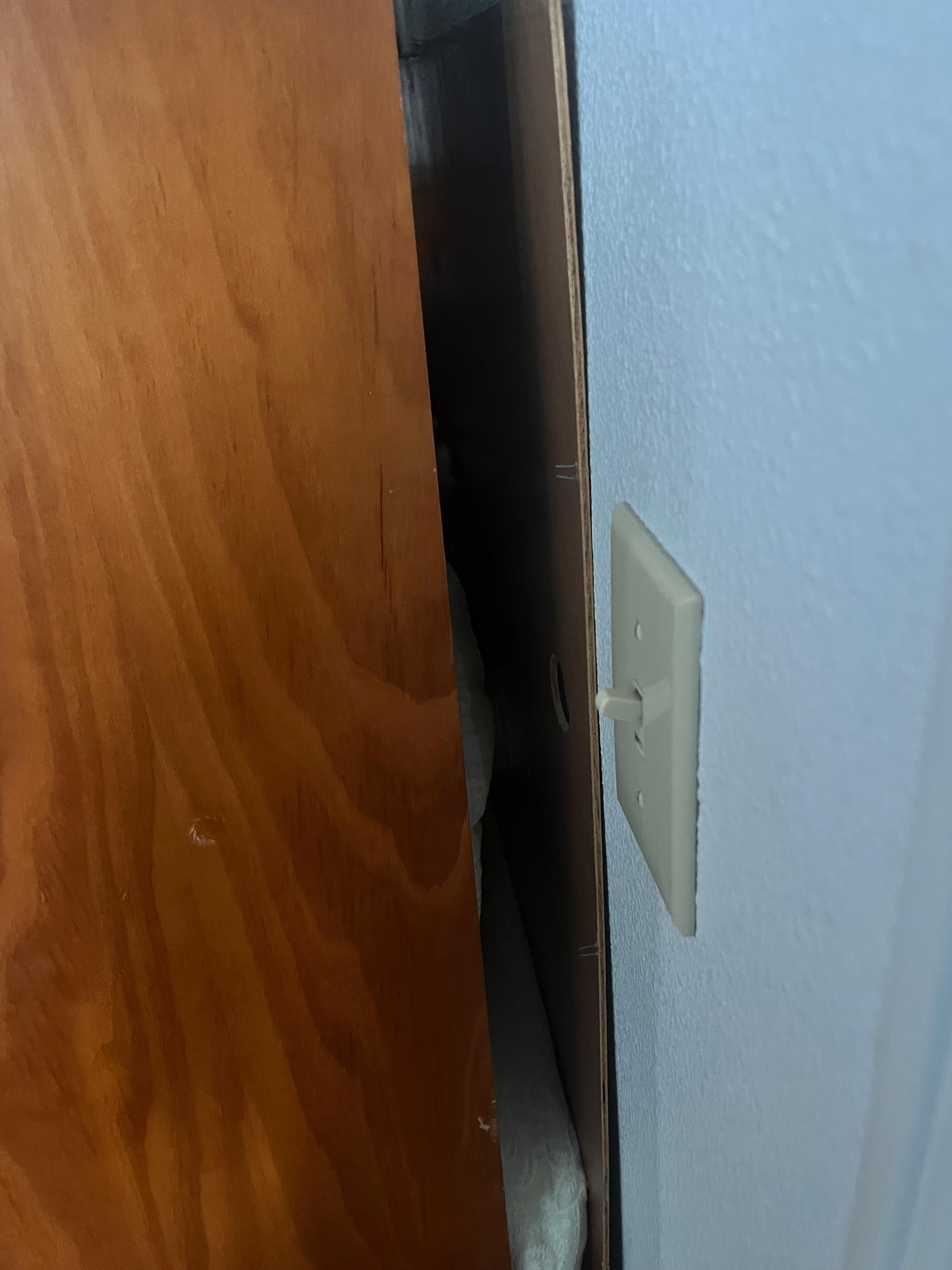 Exposed staples right near light switch 
