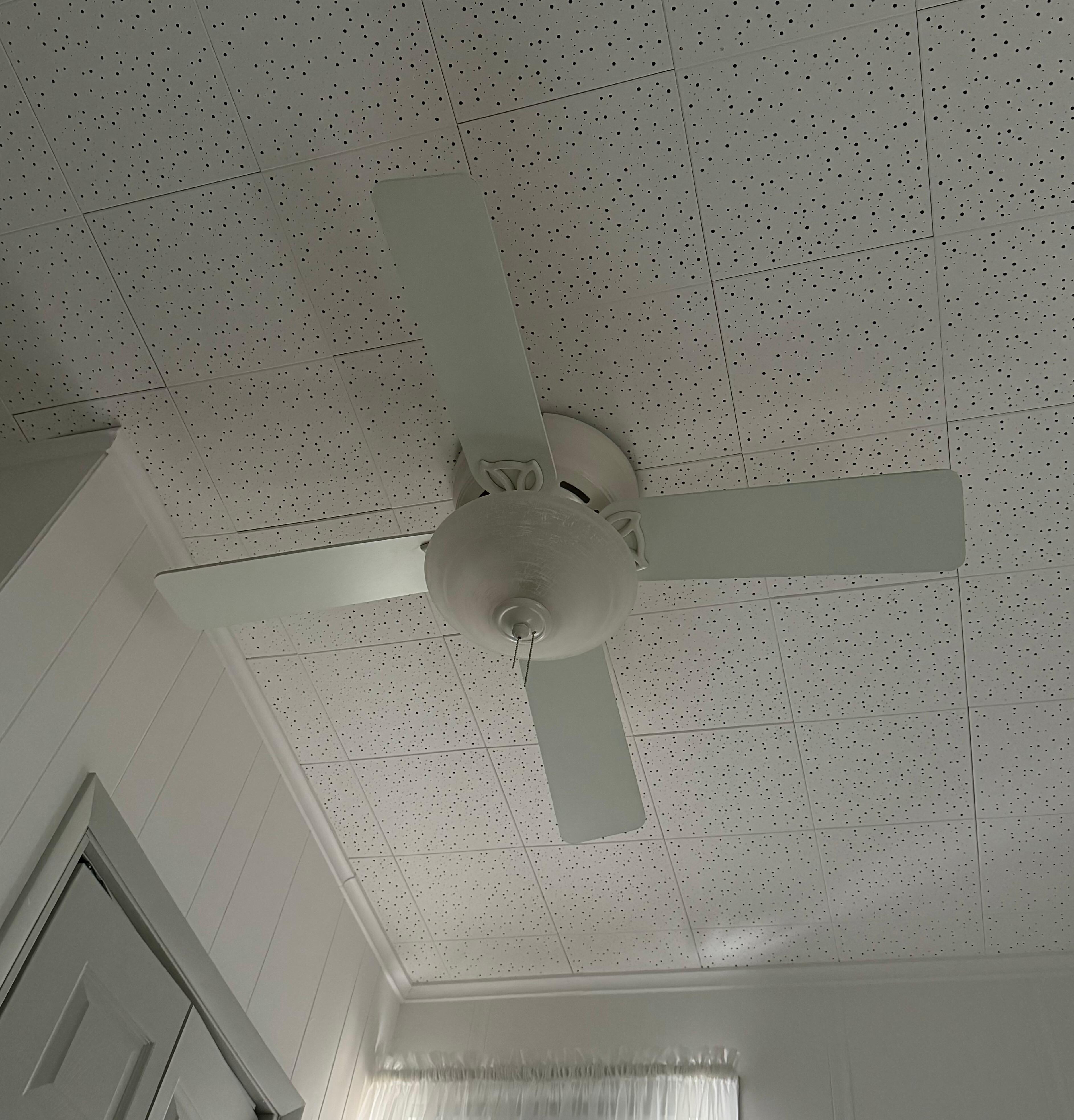 Classy touches like these muted green fan blades that coordinate with the trim.