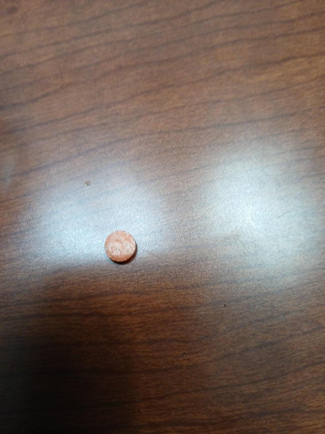 Drugs in the room. Right on the nightstand.  Believe it may be ecstasy. 