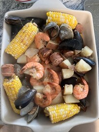 Seafood boil cooked on stovetop, served in VRBO serving dish