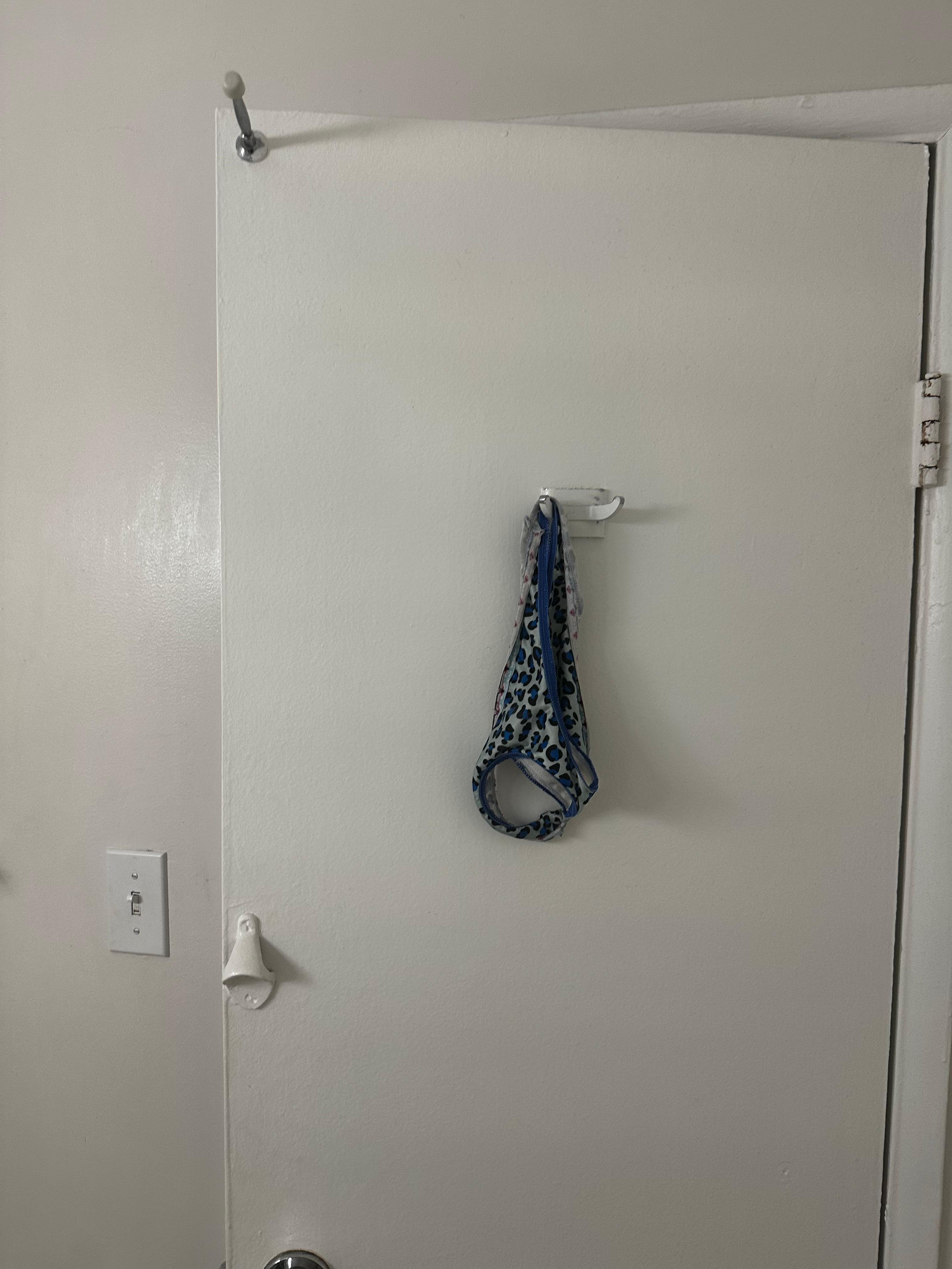 Thong behind door