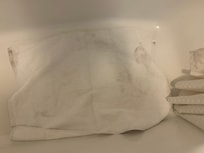 Dirty towel in bathroom tub