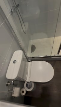 Still shot of video. Toilet was nice and shower was great. Rainhead and wand attached. Roomy as well. Great hot water.