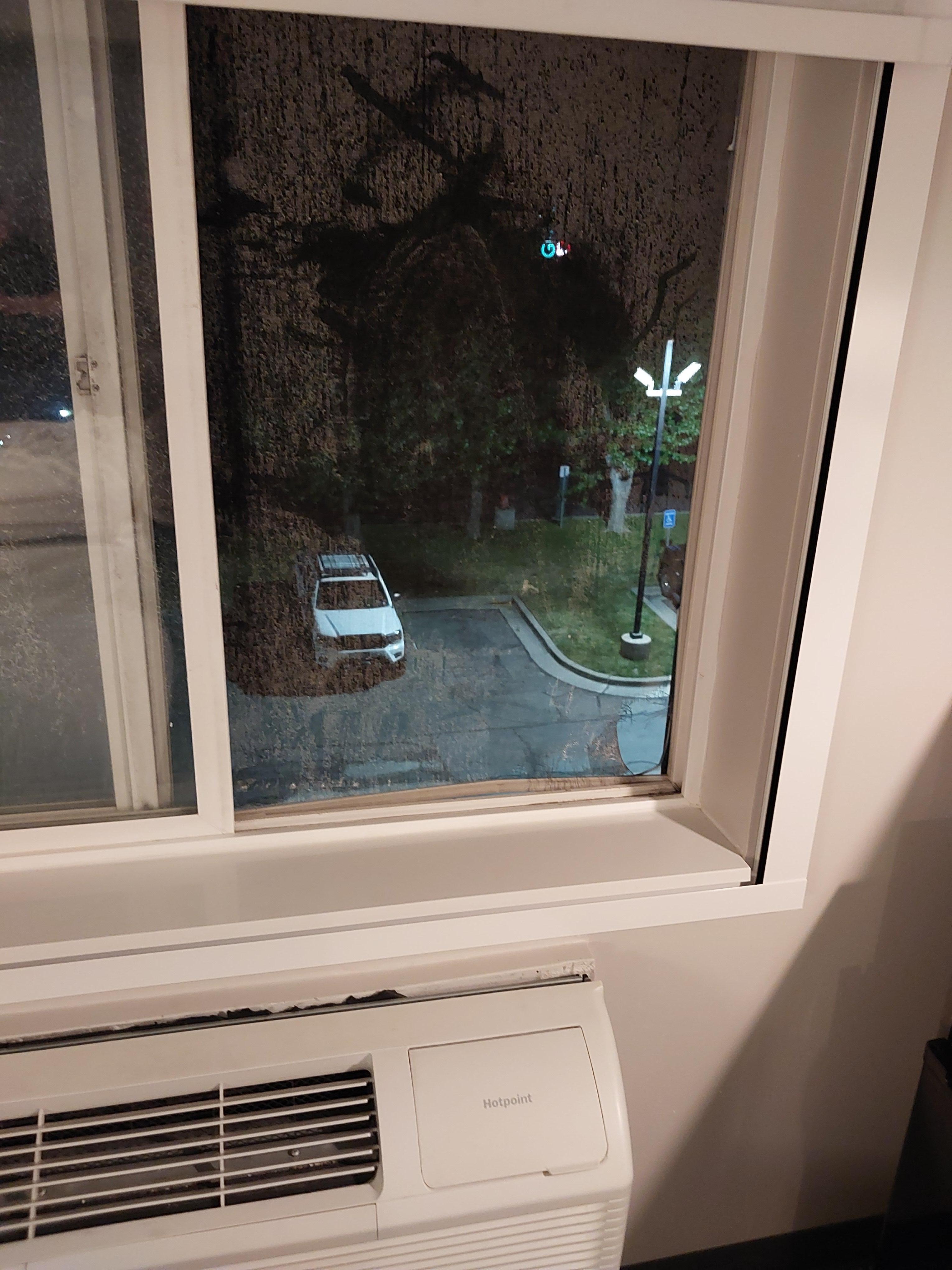 Window opens, but I wouldn't put toddlers in this room. Big hole in nasty screen. A/C unit cover falling off of every unit I've seen. 