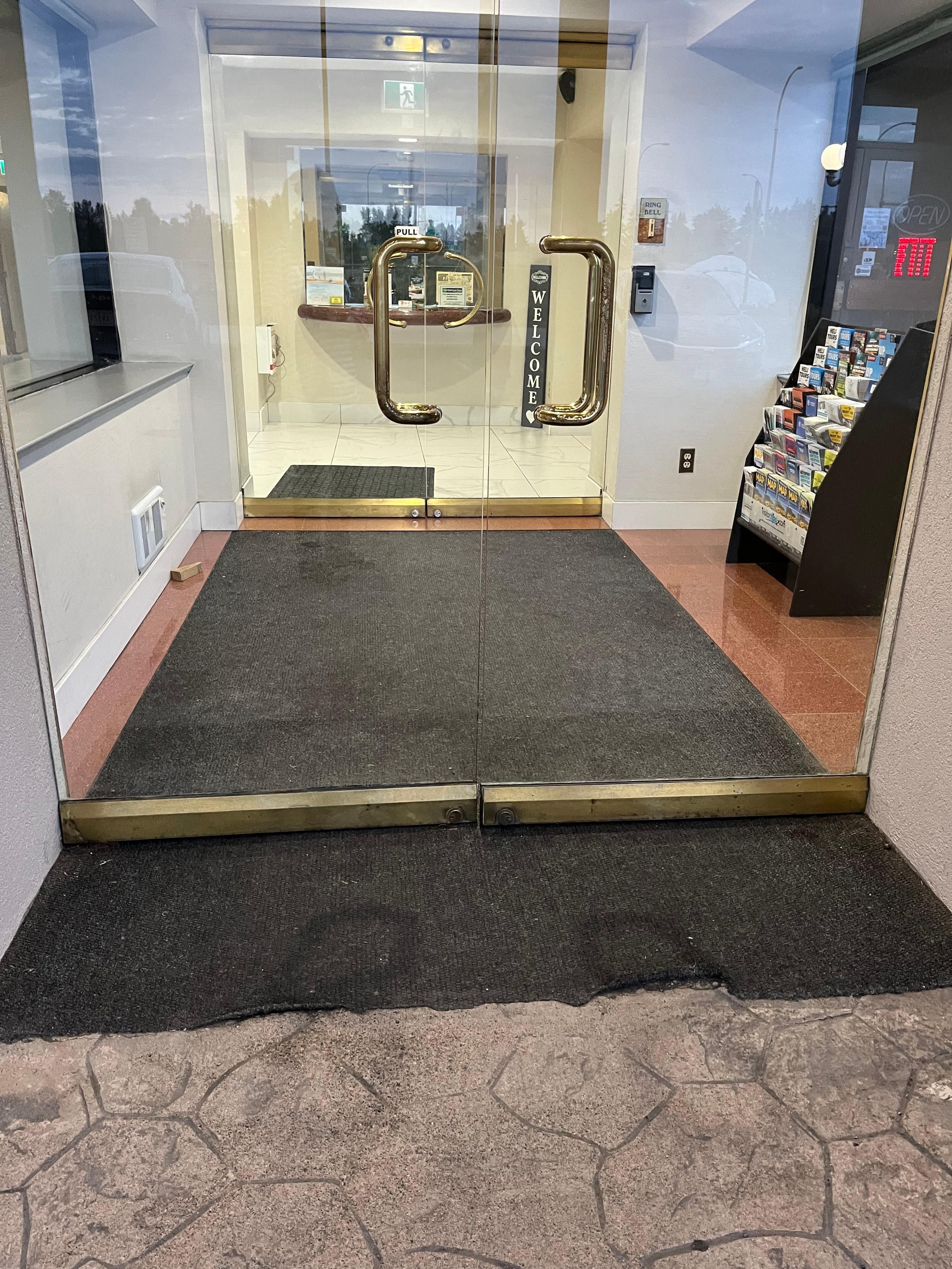 Door to lobby did not stayed closed. ‘Carpet’ was crumpled up around edges (hard to see in picture).  Would be a safety hazard to anyone with mobility issues. 