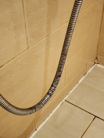 The shower hasn't been cleaned in months.