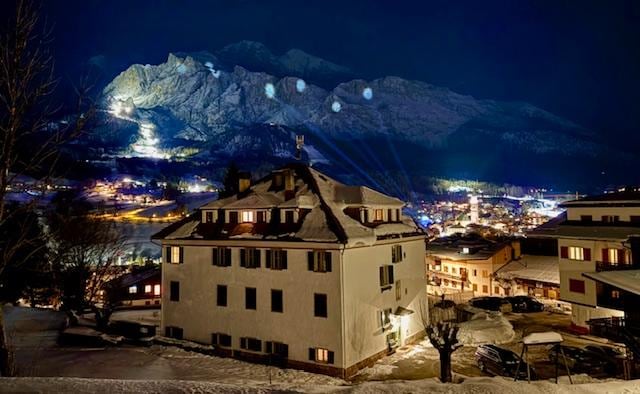 View of the Olympic circles on the mountain and alpine ski run from condo balcony