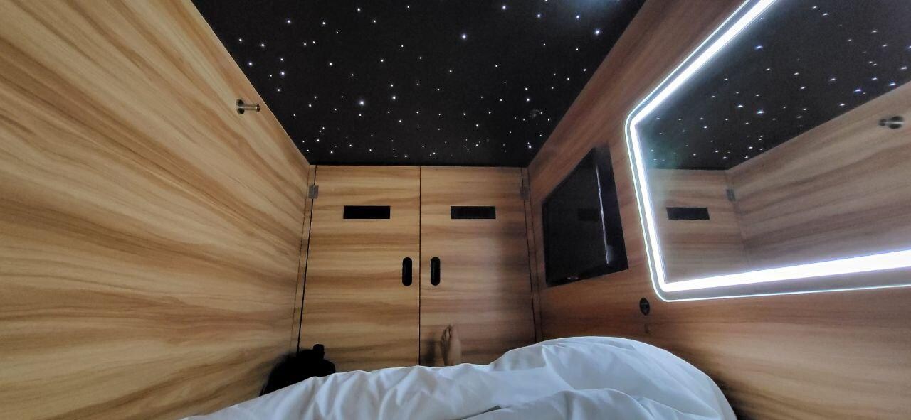 my capsule - it has a TV, a safe, a shelf, light, it's cozy