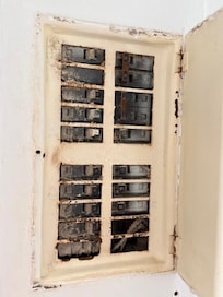 Dirty breaker box inside the kitchen (door was open)