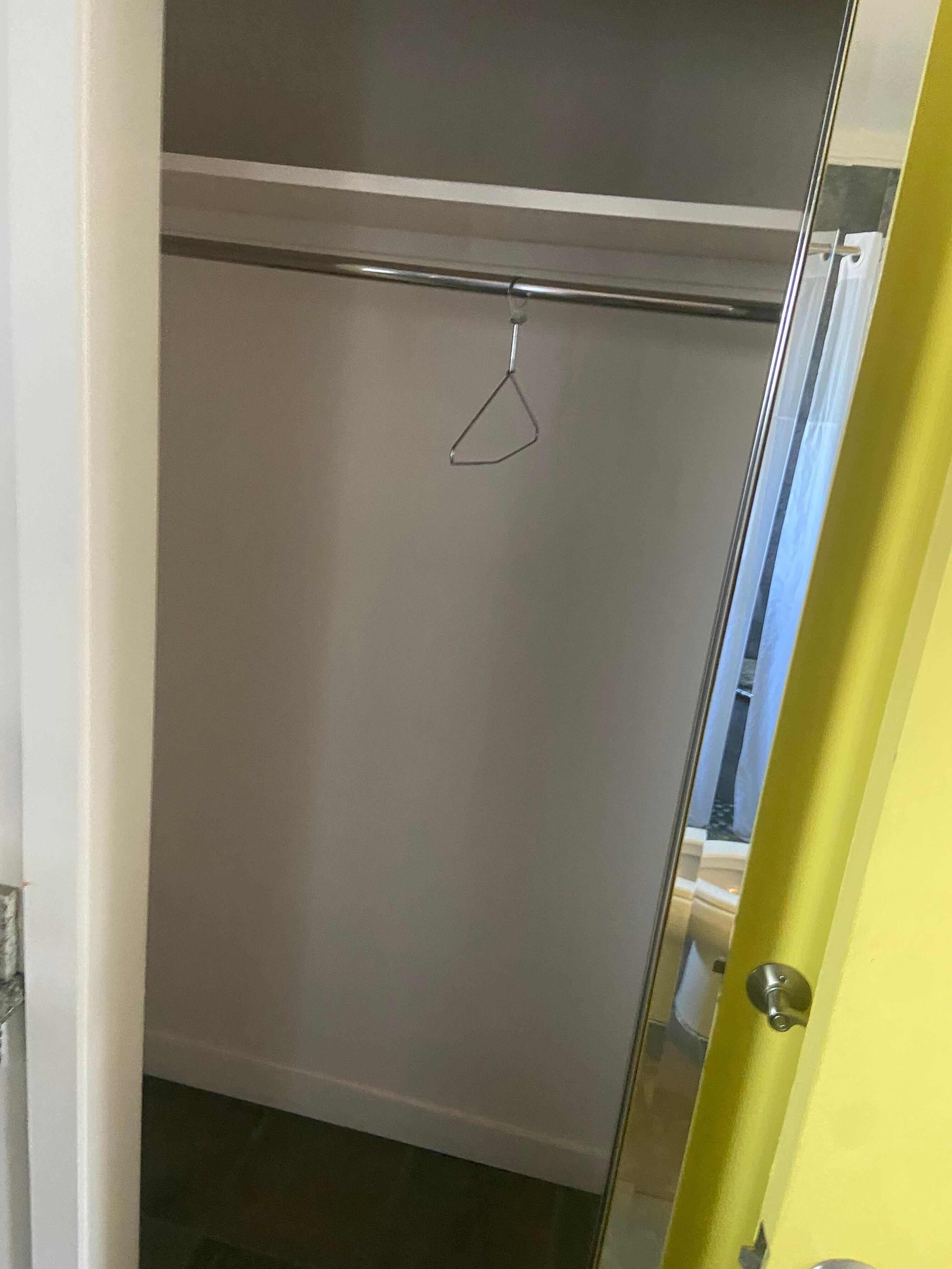 The only place to store clothing is in the bathroom and only by hanger. We didn’t use it at all. As you can see in the first photo, we put our luggage on the table and chair in the room. 
