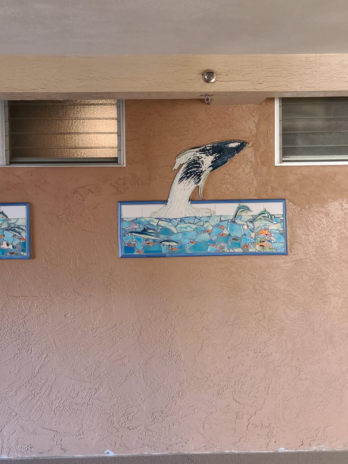 These beautiful panels are on each floor, each one different. We found out the artist and are having one made.