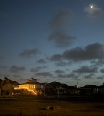 A beautiful view of the house at moonrise.