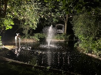 The grounds beautiful area to sit with water fountain