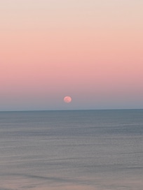 Moonrise over the ocean from the condo balcony.