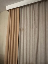 Large stains on curtains.
