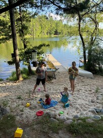 Kids enjoying the sand on Perch Lake.