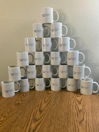 You are allowed to bring the mugs to your room.