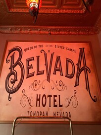 “Belvada” cast in rosy glow, with the light is just right. This is right next to the elevator.