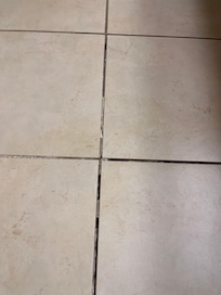 Missing grout, and the tiles moved.