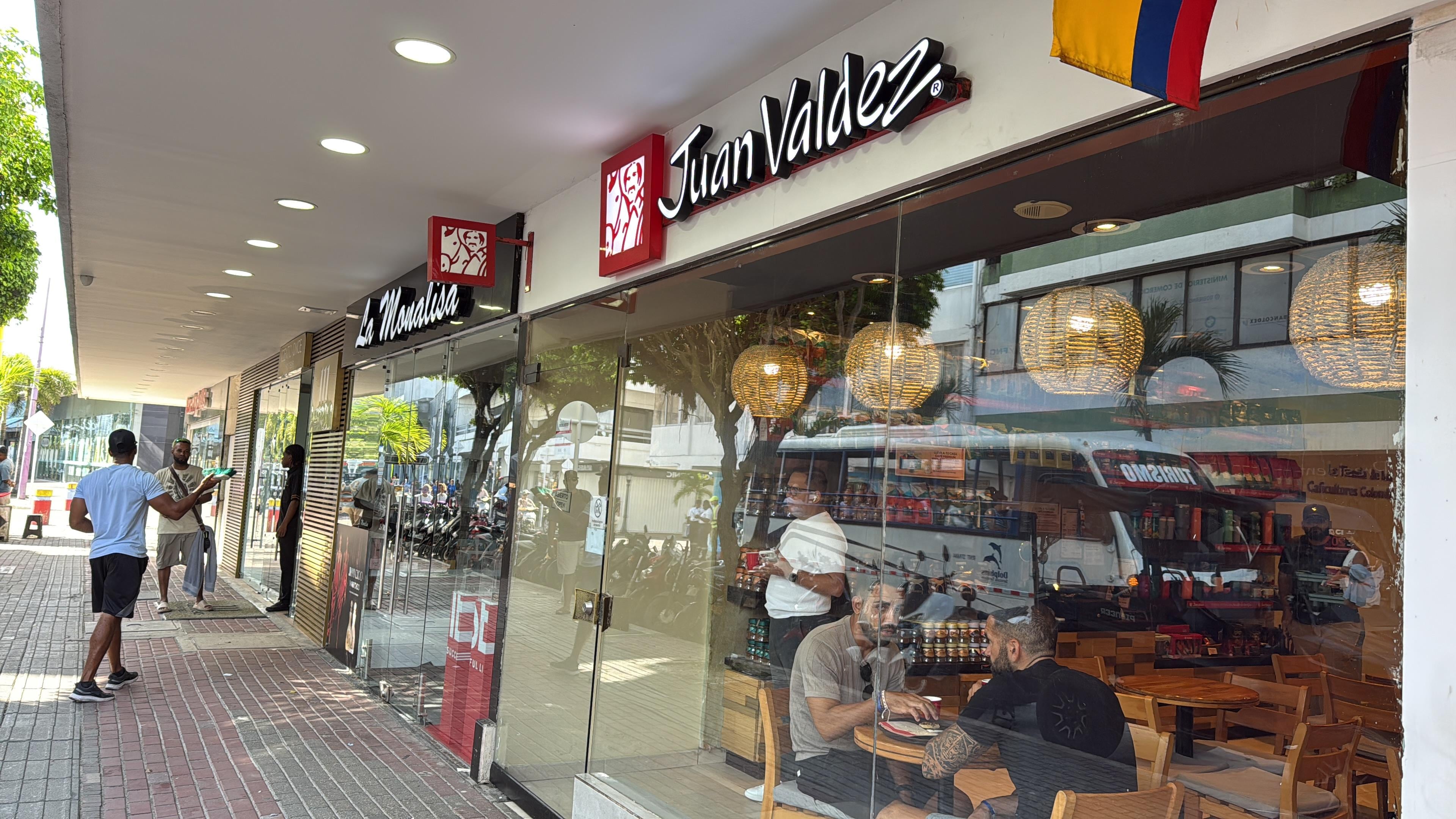 Hotel entrance is two doors down from Juan Valdez (porter in doorway). 