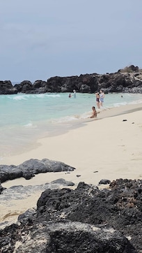Enjoying the beach with our grand daughter