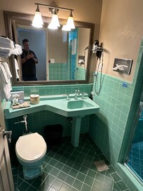 Bathroom had low water pressure in shower and no where to hang clothes..