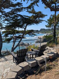 Adirondak chairs overlooking the cliff from another area of the property