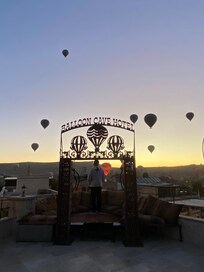 Early morning sunrise hot air balloon scene from the terrace