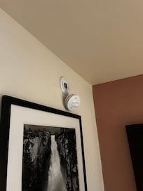 Fire alarm hanging off wall