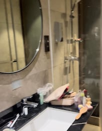 The image of the shower in this photo was indeed reflection from the mirror wall, which was adjacent to the sink. Be cautious!!!!