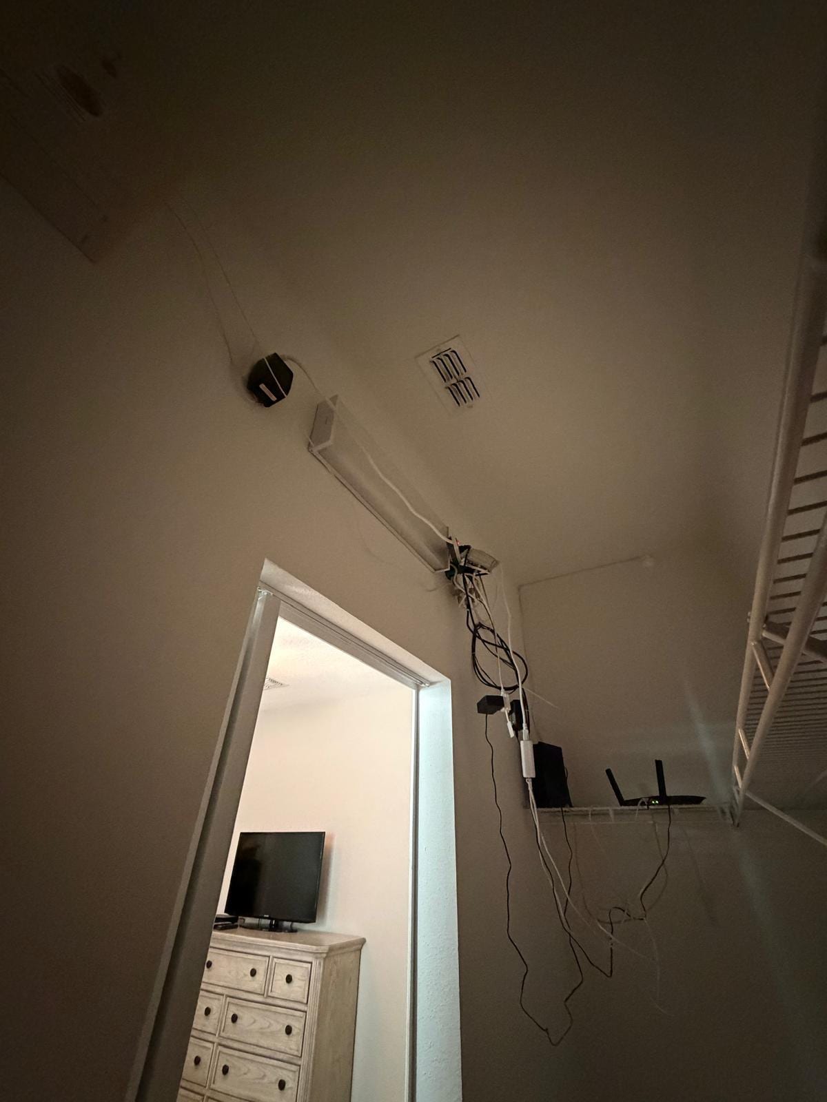 Unsafe wires hanging from ceiling. 