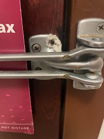 Door inside my room, safety latch, the screw is too small and a paper towel was used to make the screw fit and stay in