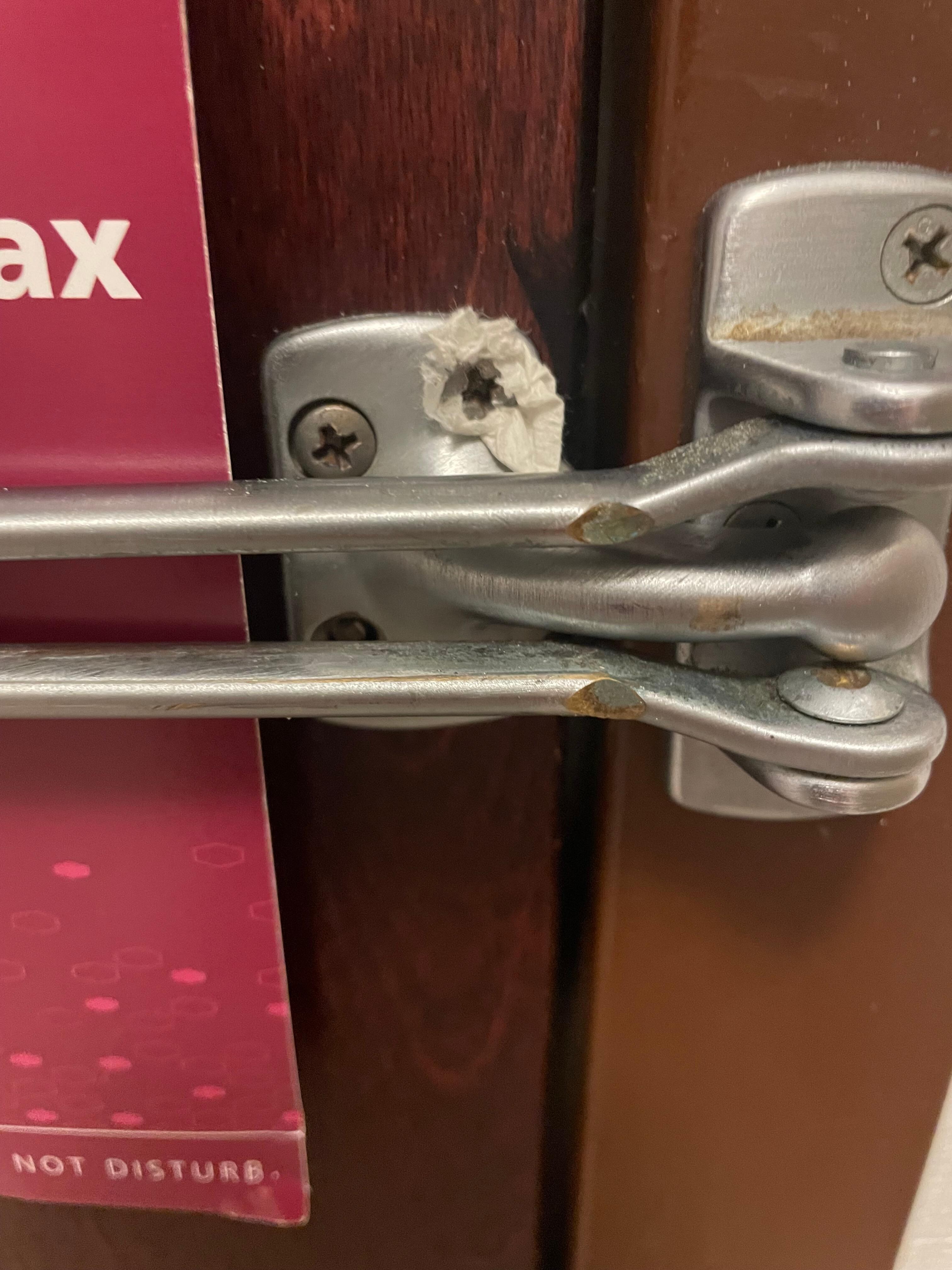 Door inside my room, safety latch, the screw is too small and a paper towel was used to make the screw fit and stay in 