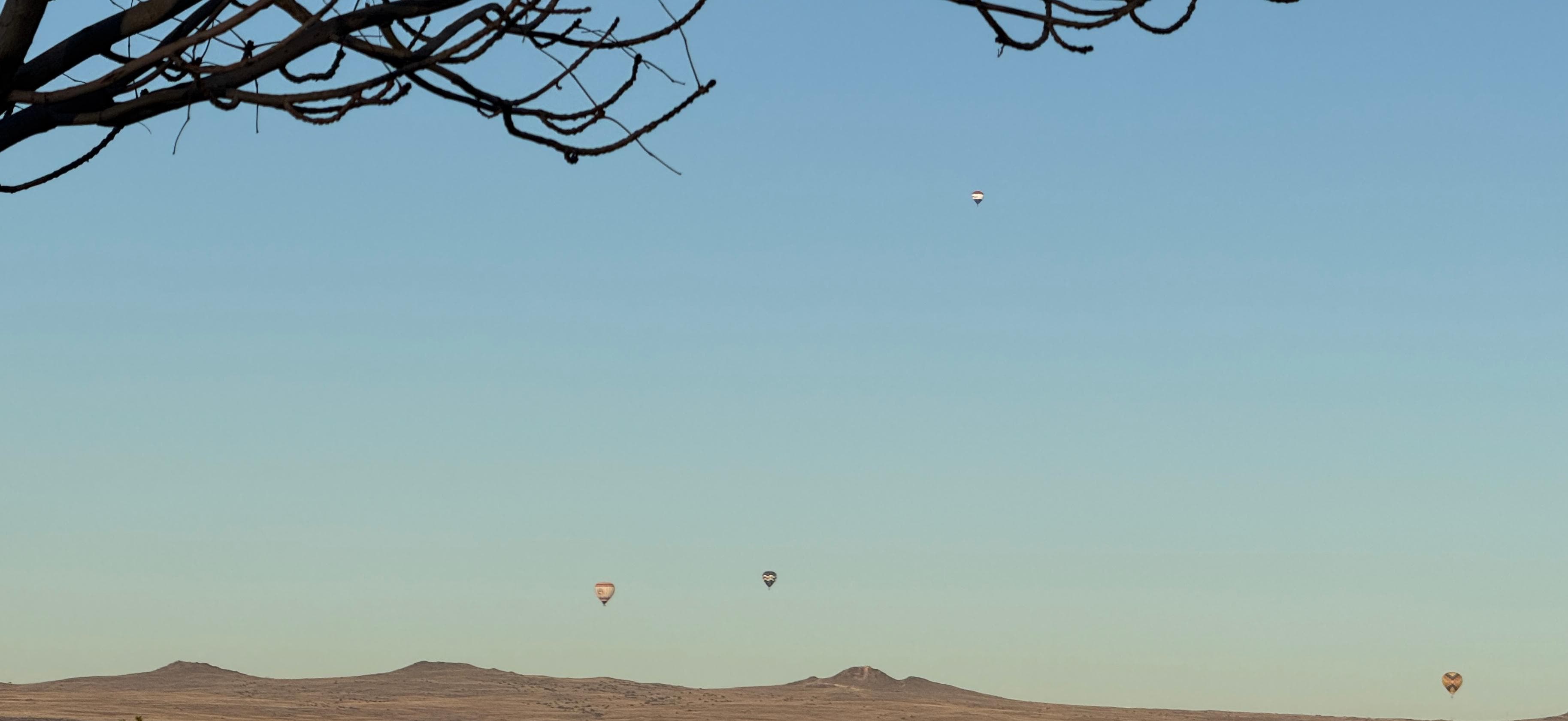 Morning view of hot air balloons from hotel 