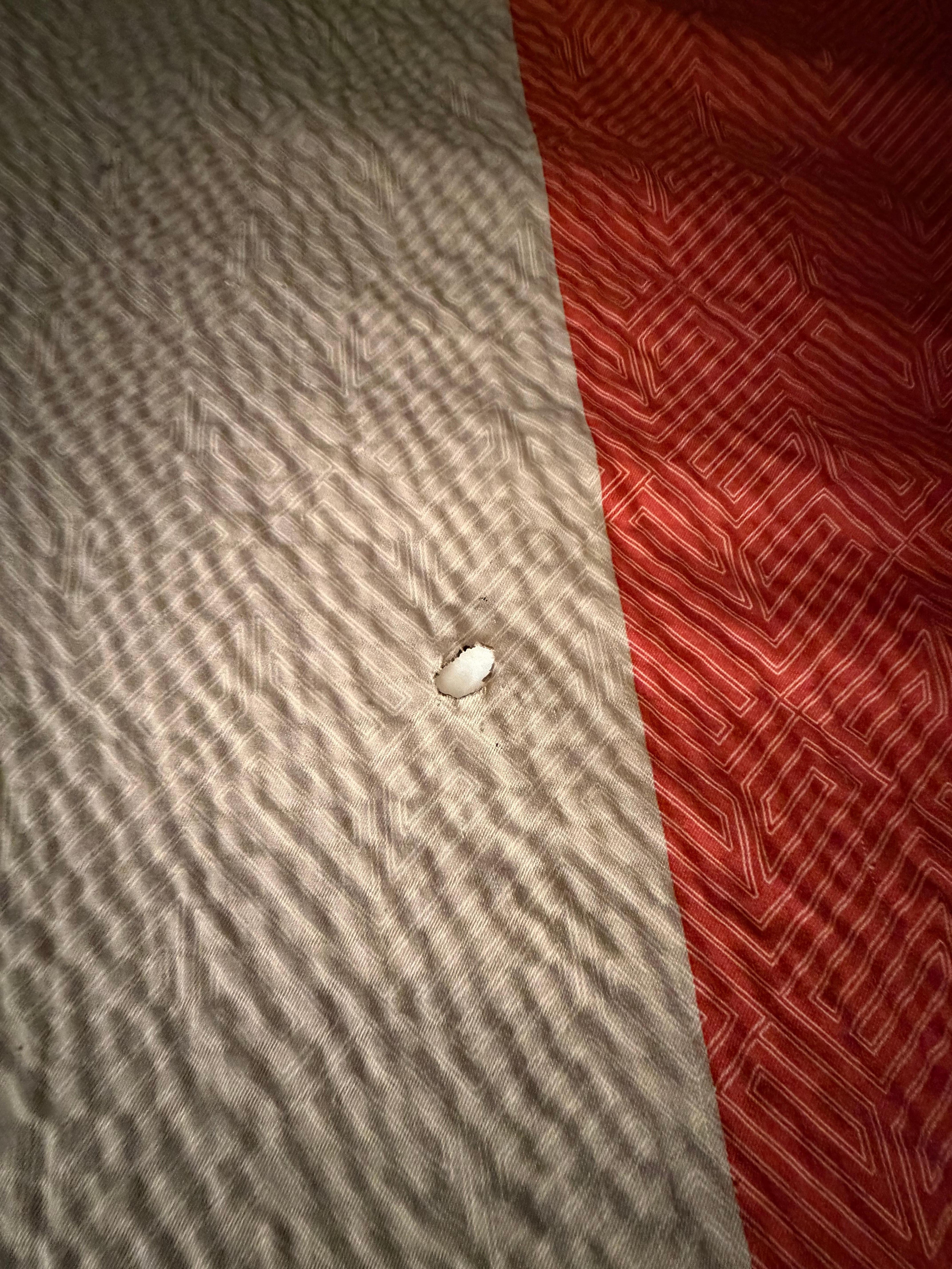 Burn holes in several areas 