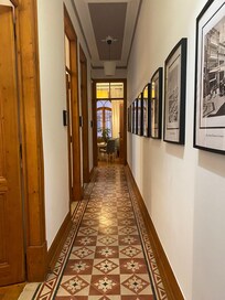 The entry hallway with bedrooms to the left and the living area at the end. Loved the authentic tiles!