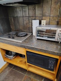 The description didn't mention a stove top but it had a nice one and the toaster oven was great for our morning bagels.