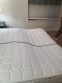 Side view: Extremely broken mattress