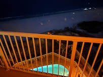 View of the beach at night from the balcony. We had fun looking for ghost crabs at night! (People with the flashlights)