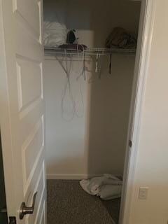 Dirty towels on the floor of the bedroom closet.