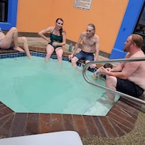 Family around the hot tub..
