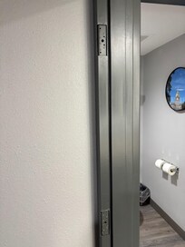 Note door frame with mounting holes for door.