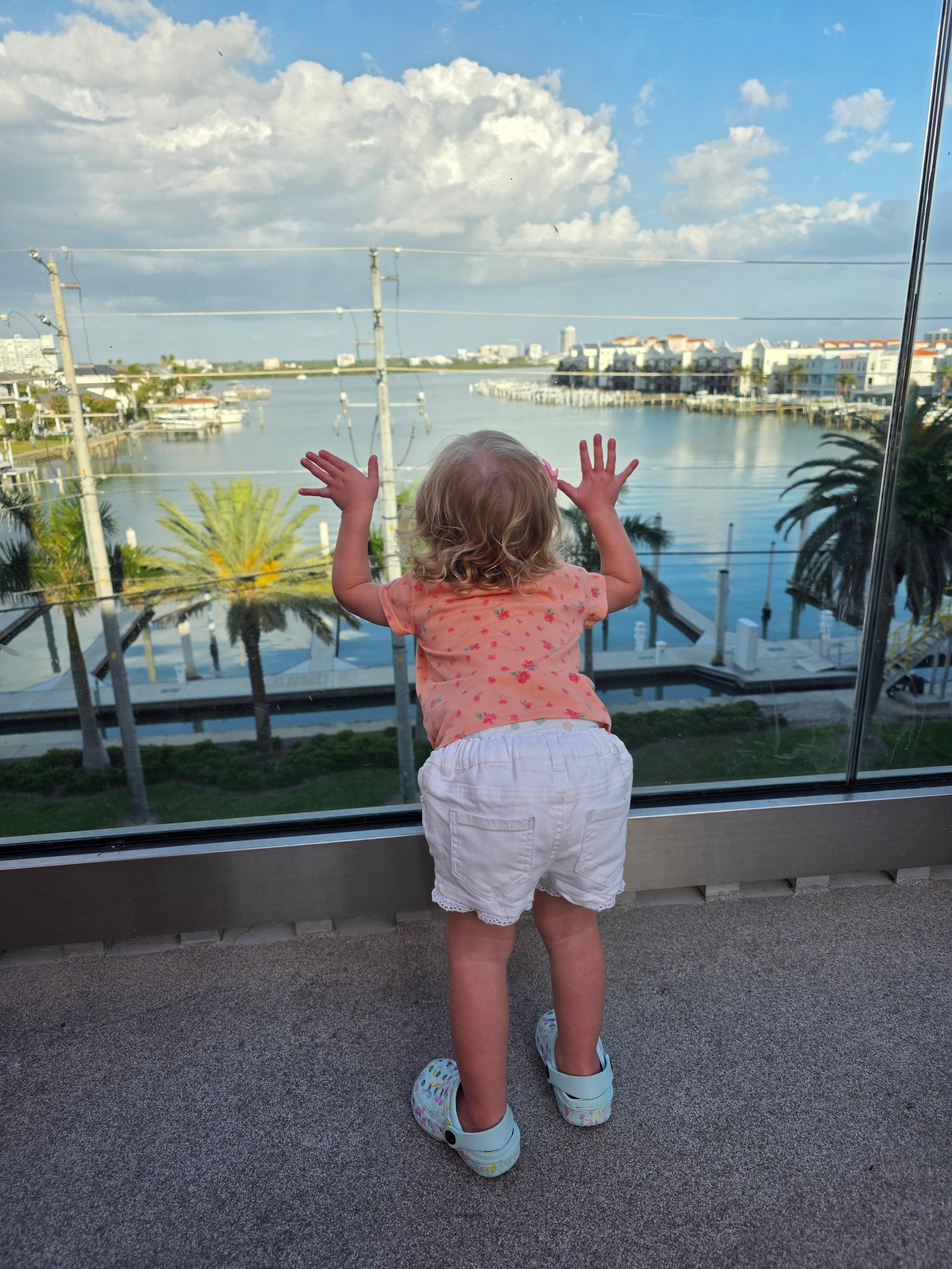 My baby girl looking out to the water, in the pool area! 