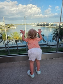 My baby girl looking out to the water, in the pool area!
