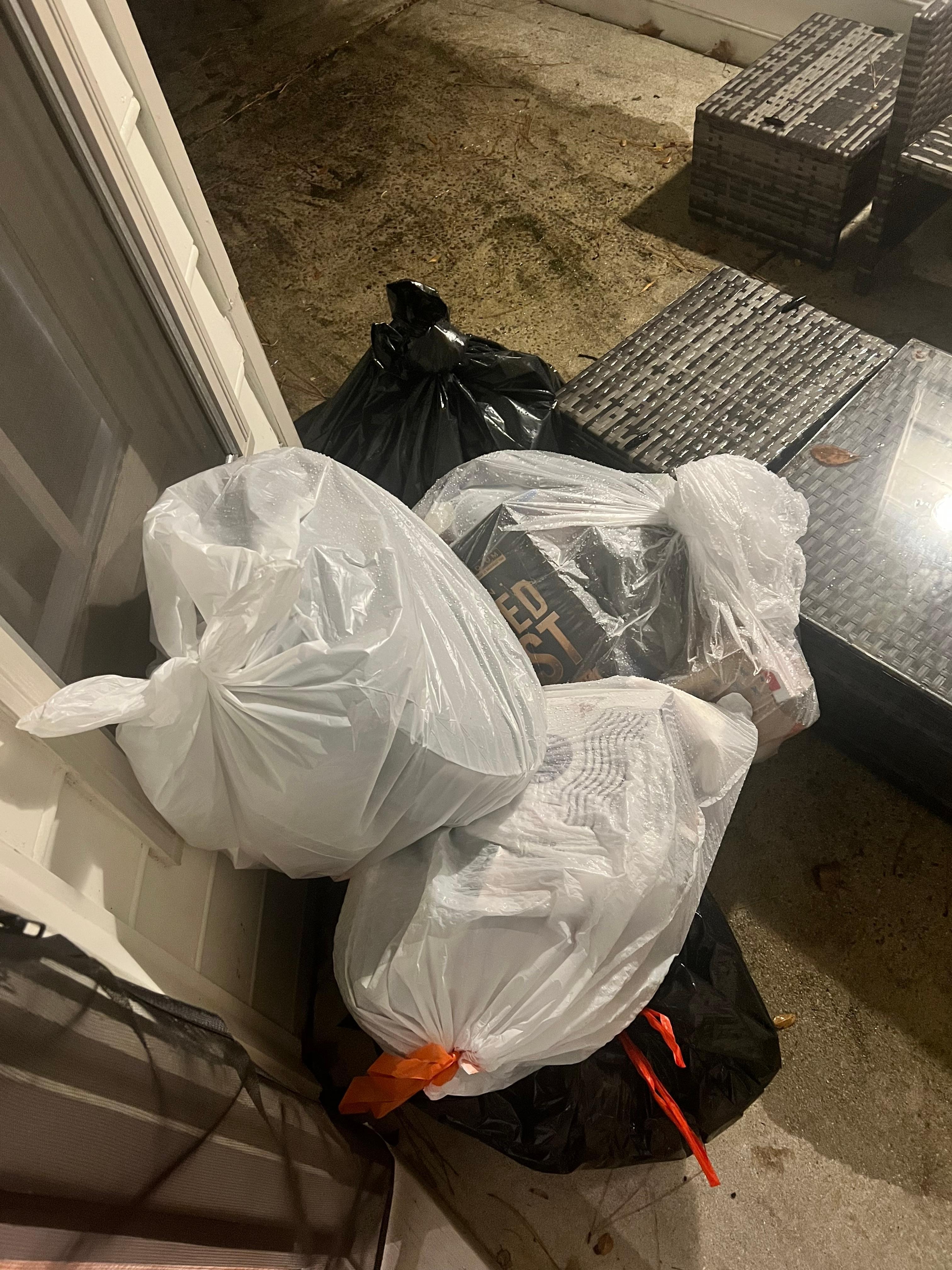 Trash bags in the advertised outdoor area.  These bags remained throughout the duration of our stay.