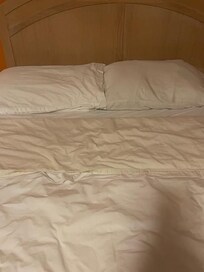 Bed upon entry into the room.