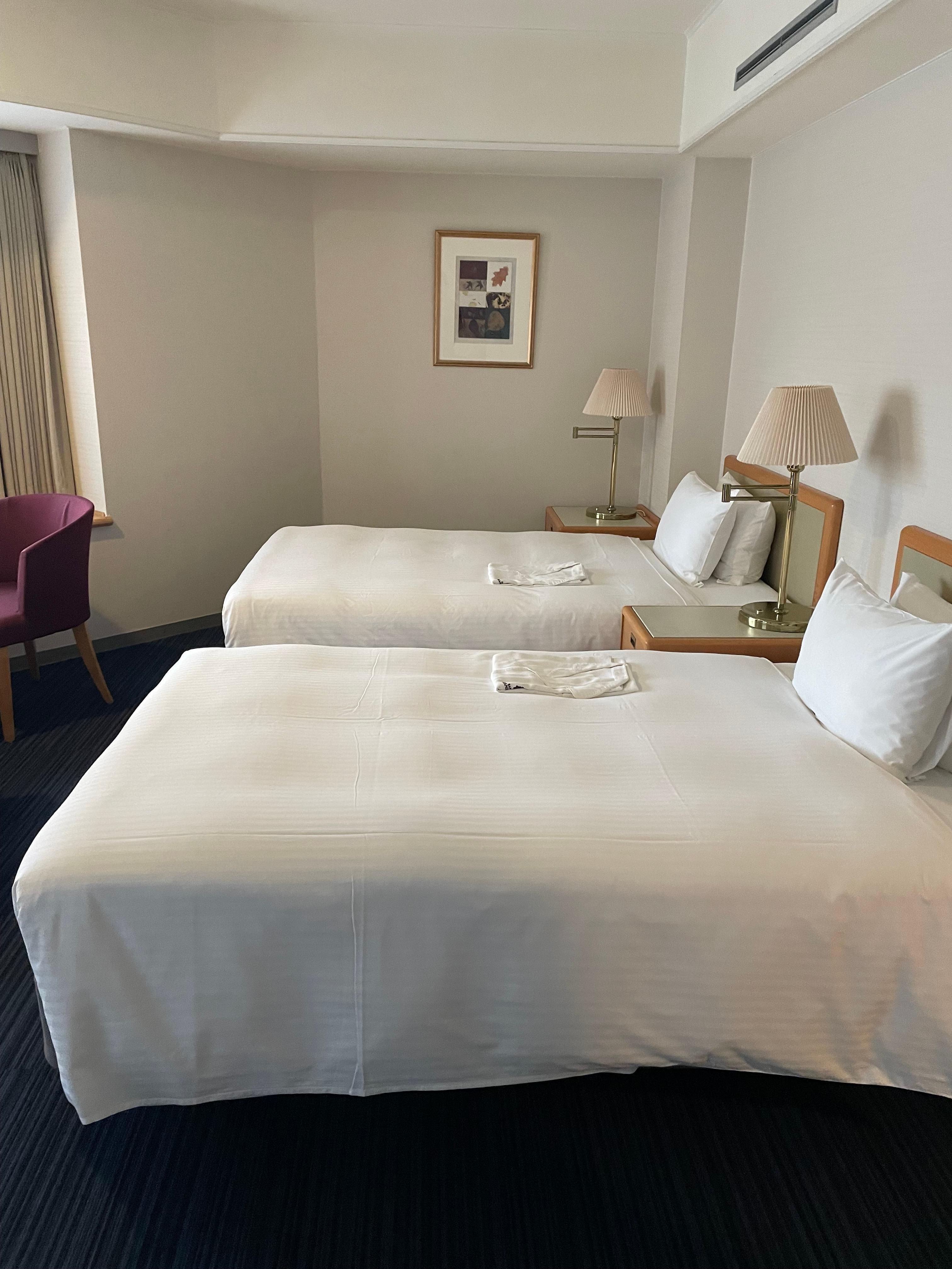 Spacious rooms for family to share. There’s a separate bath and additional sink area too.