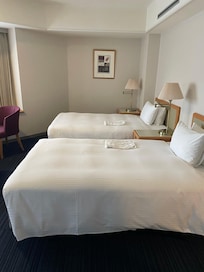 Spacious rooms for family to share. There’s a separate bath and additional sink area too.