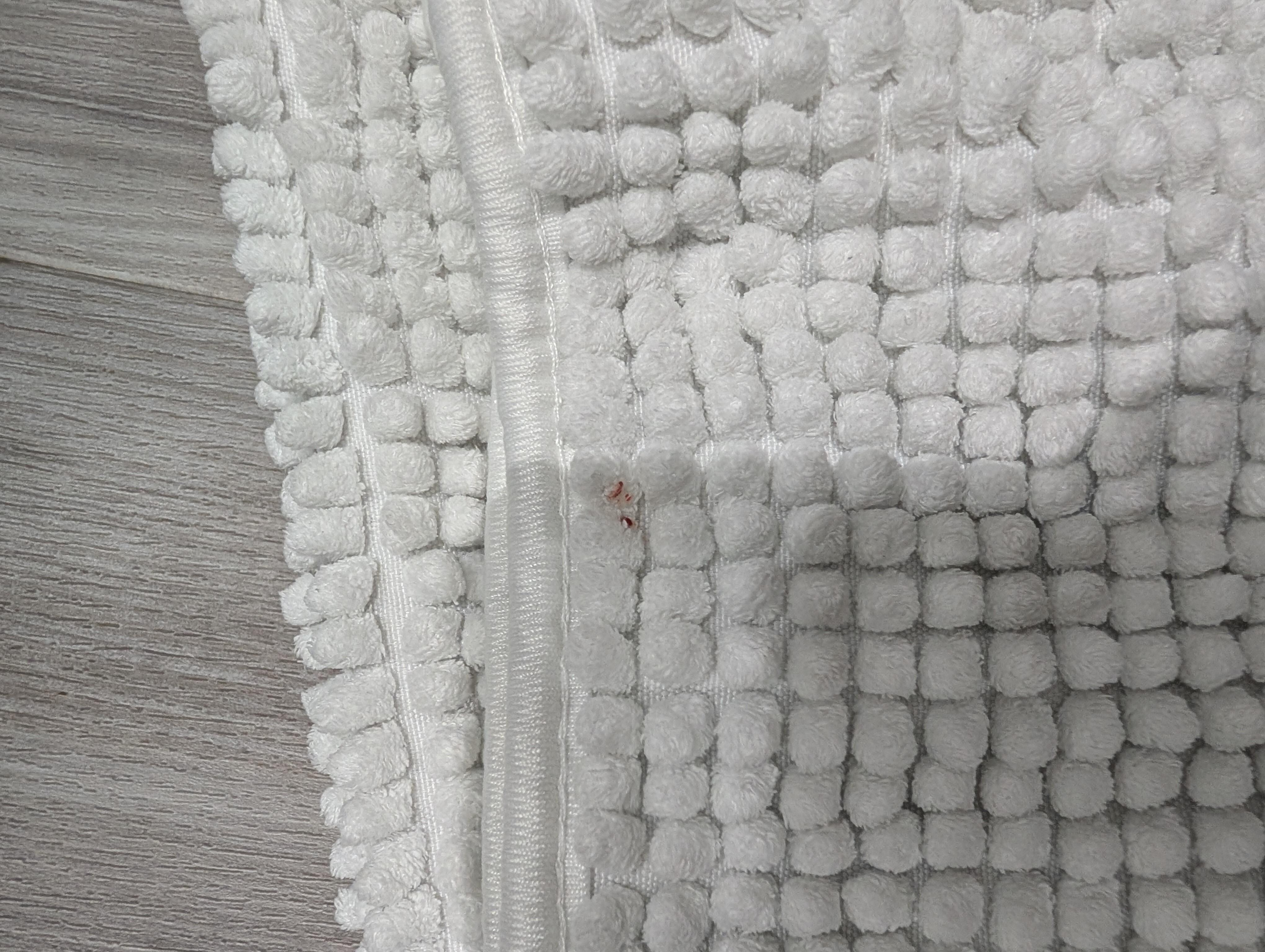 blood stain on bath mat